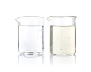 Glass beakers with clean and dirty water isolated on white