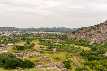 A mountain range with a town in the distance