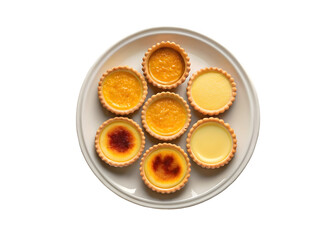 Delicious golden tarts and pastries arranged in circular pattern on plate food photography baked goods dessert light background appetizing mouthwatering png file isolated on transparent background