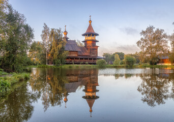 Wooden Orthodox church with reflection in pond, Blagoveshchenye village, Russia