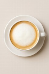 White cup filled with frothy cappuccino coffee served on light background top view minimal style