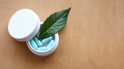Top view of pills with container and copy space.