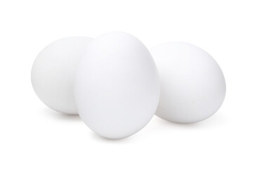 Three raw chicken eggs isolated on white