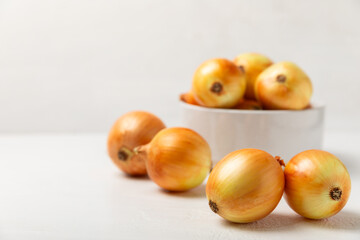 Onion on the kitchen table. onion slice. onion rings. Fresh Yellow Onion. Natural, fresh, vegetarian food. Agricultural products. Healthy eating. Vegetables. Farmer's market. Space for text.Copy space