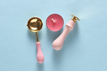 Wax Seal Making Kit on Blue Background. Top View. Flat Lay