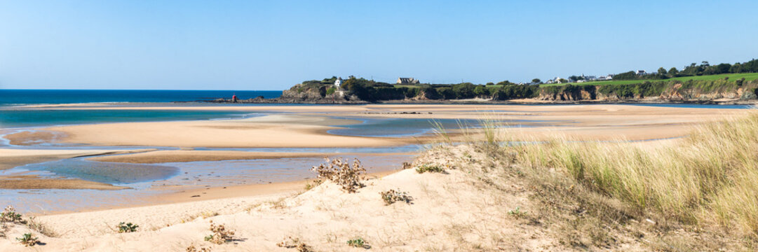 Guidel morbihan clohars carnoet finistere Wide Sandy Bay at Low Tide Under Blue Sky