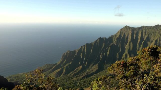 Overlooking the rugged na pali coast of kauai island with the vast pacific ocean