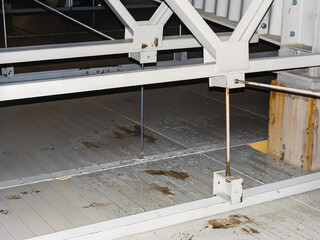 Detailed shot of metal beams and rods in an industrial setting.