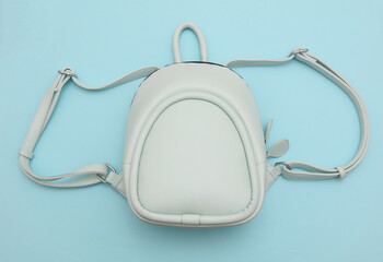 Modern urban leather blue backpack on pastel background