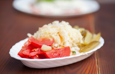 Plate of pickles on a table in a restaurant