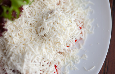 Restaurant dish tomato slices with grated cheese