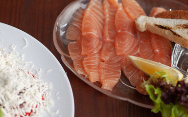 Salmon slices on a plate. Restaurant dish