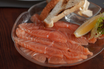 Salmon slices on a plate. Restaurant dish
