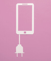 Paper-cut smartphone icon with electric plug on a pink background