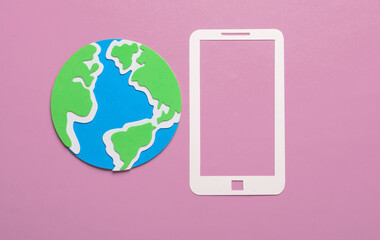 Paper-cut smartphone icon with globe on a pink background