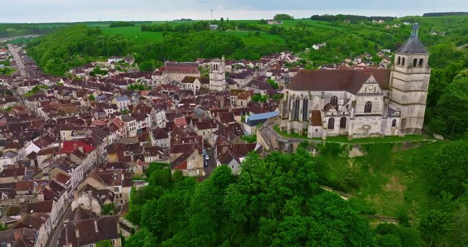 Aerial view of ancient town of Tonnerre with unusual water reservoir Fosse Dionne. Burgundy France