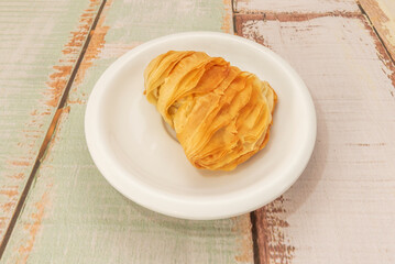 Classic French hand-rolled croissants: each layer visible to the naked eye, baked to the perfect golden brown