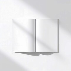 Open book with blank pages on a white background casting shadows ideal for mockups and designs providing clean copy space