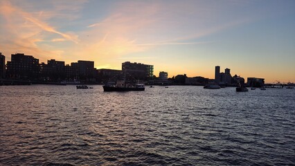 Fototapeta premium Sunset from the water in Amsterdam during Sail