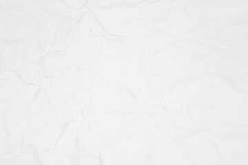 White crumpled paper texture background. Abstract wrinkled creased paper sheet pattern for backdrop, wallpaper, or design overlay.