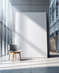 Modern, empty room with large blank canvas and chair