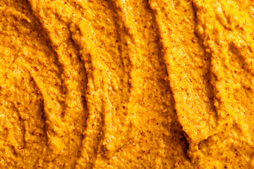 Smoothie of fresh fruits and berries, orange, banana, mango, sea buckthorn, cloudberry. Ice cream texture. Fruit yogurt ice cream. Delicious sweet dessert close-up as a background.