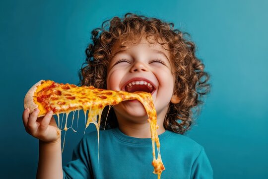 Happy child eating cheesy pizza slice