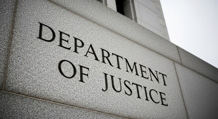 Department of Justice" inscribed in stone on a building's exterior