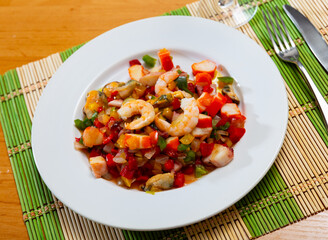 Bright appetizing Salpicon de Marisco, combining medley of seafood and diced fresh vegetables, embodying essence of Spanish cuisine