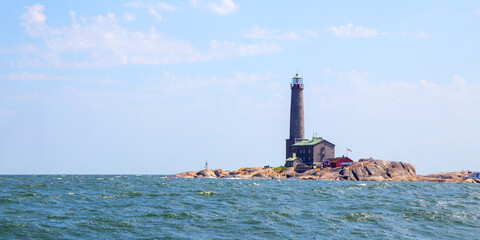 Bengtskar Lighthouse near Hanko, Finland. Tallest lighthouse in Scandinavia, rising above Baltic Sea, surrounded by rocky islands. Historic maritime landmark and popular tourist destination