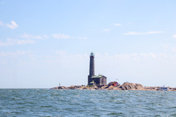 Bengtskar Lighthouse near Hanko, Finland. Tallest lighthouse in Scandinavia, rising above Baltic Sea, surrounded by rocky islands. Historic maritime landmark and popular tourist destination