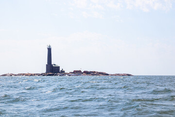Bengtskar Lighthouse near Hanko, Finland. Tallest lighthouse in Scandinavia, rising above Baltic Sea, surrounded by rocky islands. Historic maritime landmark and popular tourist destination