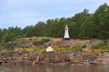 Solar-powered marine marker installed on the shore. Sustainable navigation aid in coastal waters of Baltic sea, symbolizing safety, renewable energy, and environmental responsibility