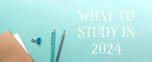 Study materials and stationery arranged on a teal background with a motivational message for students