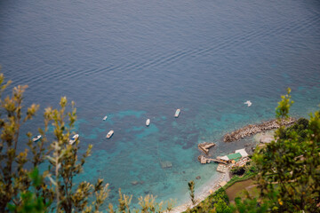 Boats and yachts on the turquoise sea of Capri Island