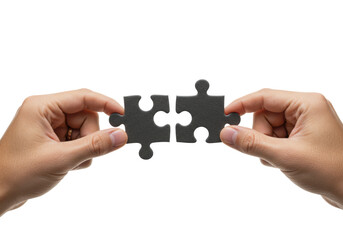 Two well-groomed human hands, neutral skin, bring dark jigsaw puzzle pieces together on a plain white studio background, conveying strategic problem-solving
