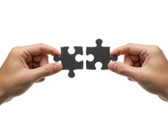 Two well-groomed human hands, neutral skin, bring dark jigsaw puzzle pieces together on a plain white studio background, conveying strategic problem-solving