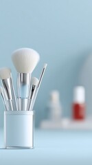 Makeup brushes arranged in a clear holder on a soft blue background, showcasing beauty tools and accessories for cosmetic application and artistry in a stylish environment