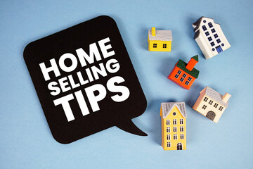 Home Selling Tips text with house models on blue background
