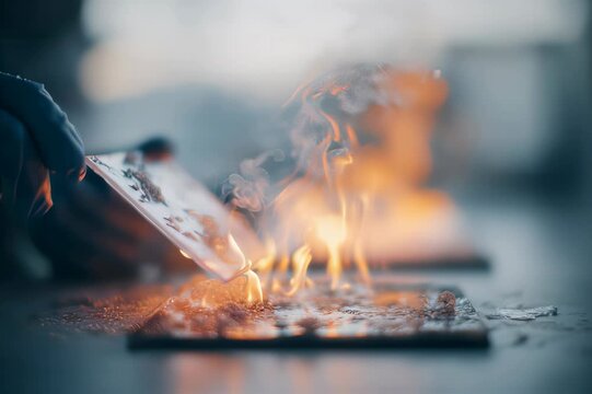 Aerogel panel undergoing dramatic flame test, highlighting its exceptional fire resistance, advanced insulation properties, and innovative material science in a laboratory setting