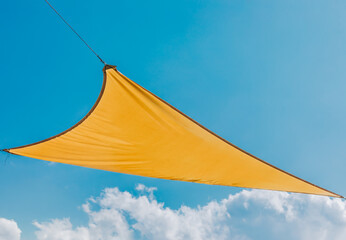 Yellow Shade Sail Against Blue Sky
