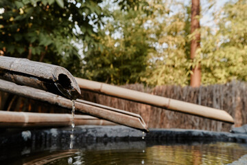 drinking water from bamboo pipes