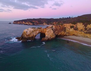 Coastal archway at sunset