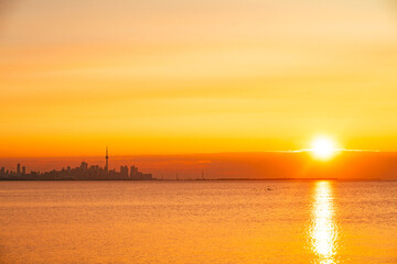 Toronto skyline in the morning. Silhouette figure of a man enjoying the Toronto sunrise