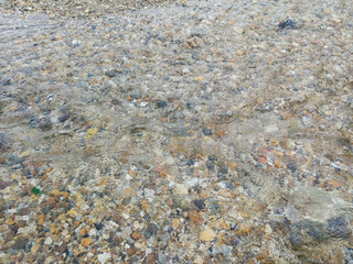 Pebbles Beneath Clear Flowing Water
