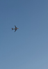 Airplane in clear blue sky concept of travel for airlines, travel agencies, tourism businesses