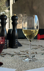 Elegant table setting with white wine glass at a restaurant - concept of fine dining for restaurants, wineries, event planners