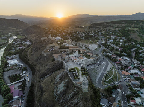 Aerial view of the Rabati Castle standing majestically with its stone walls glowing in the soft light of the setting sun, Akhaltsikhe, Samtskhe-Javakheti, Georgia.