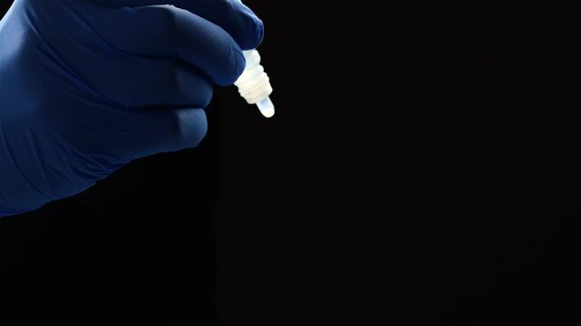 White plastic bottle with medicine for vision.
Eye drops for dryness and fatigue.
Drops for allergies and inflammation.
Medeiinsky medicine in the hands of a doctor