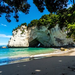 Coastal beach scene with arching rock